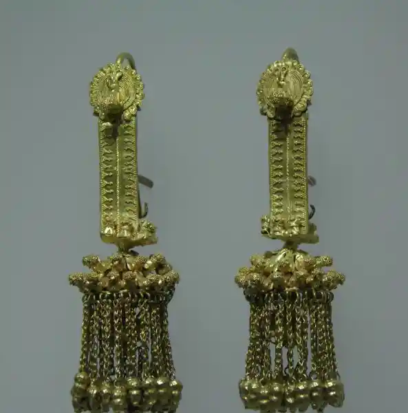 Gold pendant with winged-animal design